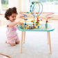 Girl Playing Hape Twisting Railway Maze Table