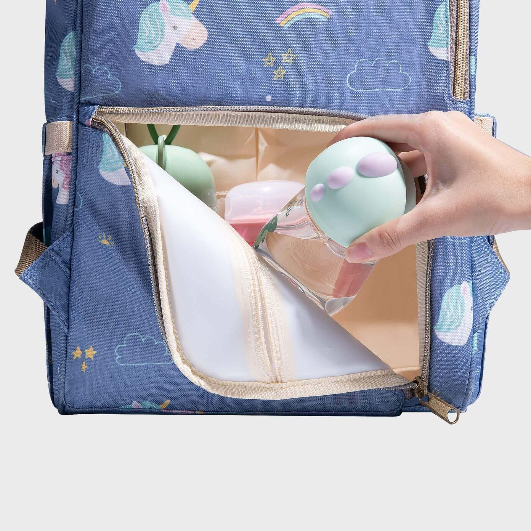 Hand take a bottle out from Sunveno Timeless Baby Diaper Backpack - Blue Unicorn