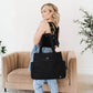 Woman Carrying JuJuBe Utility-Strap Tote Diaper Bag Black