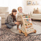 Woman and child playing with Tiny Land® Versatile Natural Wooden Baby Walker in a living room.