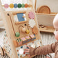 Child playing with Tiny Land® Versatile Natural Wooden Baby Walker on a carpeted floor
