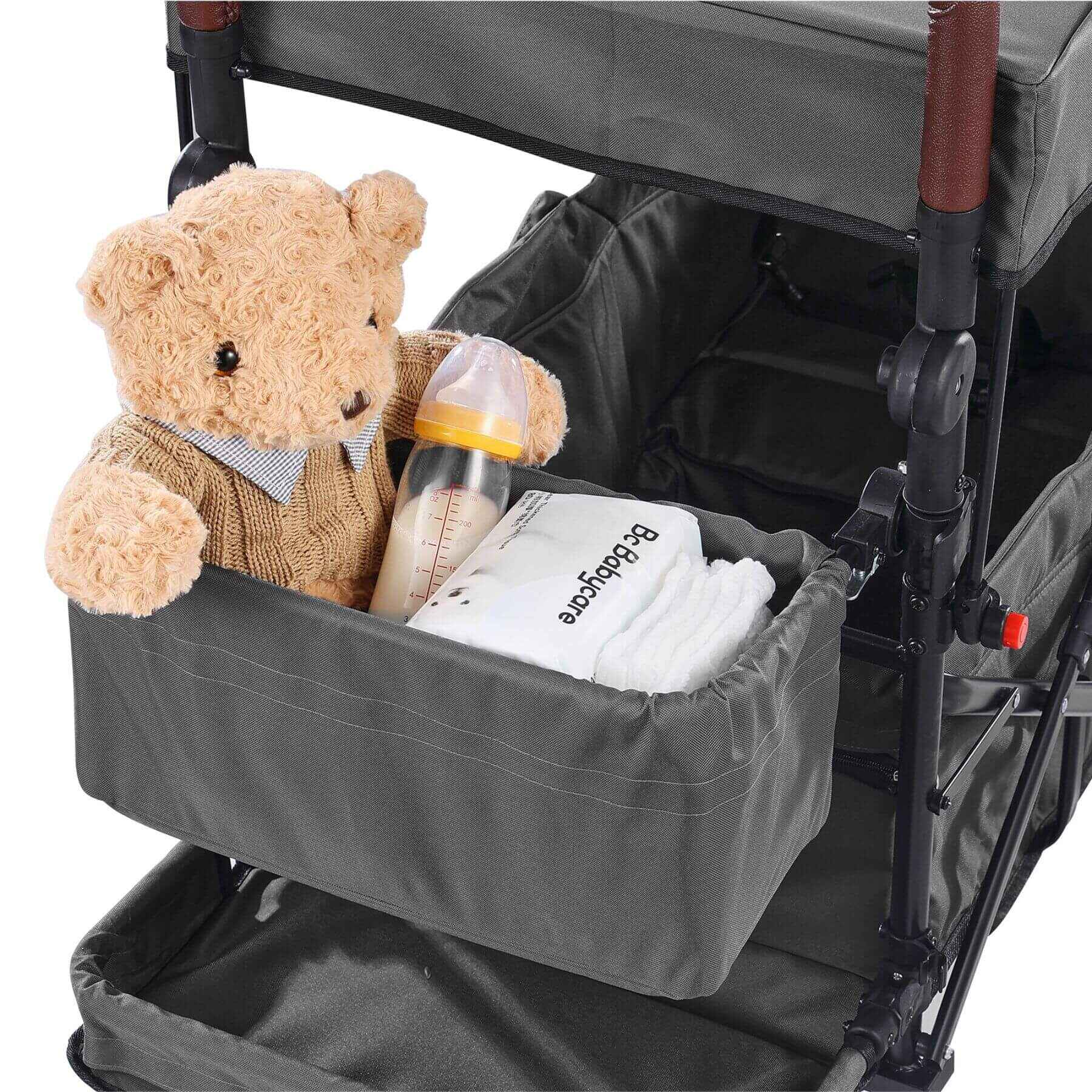 Stroller organizer with a teddy bear, bottle, and diapers inside