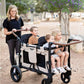 Mom Pushing Kids in Keenz Vyo͞o The Seating Chameleon Stroller Wagon 4-Passengers Grey