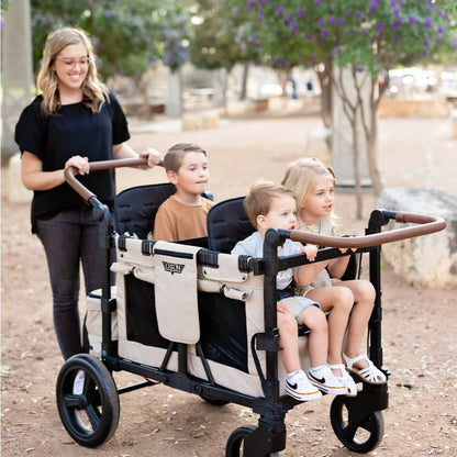 Mom Pushing Kids in Keenz Vyo͞o The Seating Chameleon Stroller Wagon 4-Passengers Grey