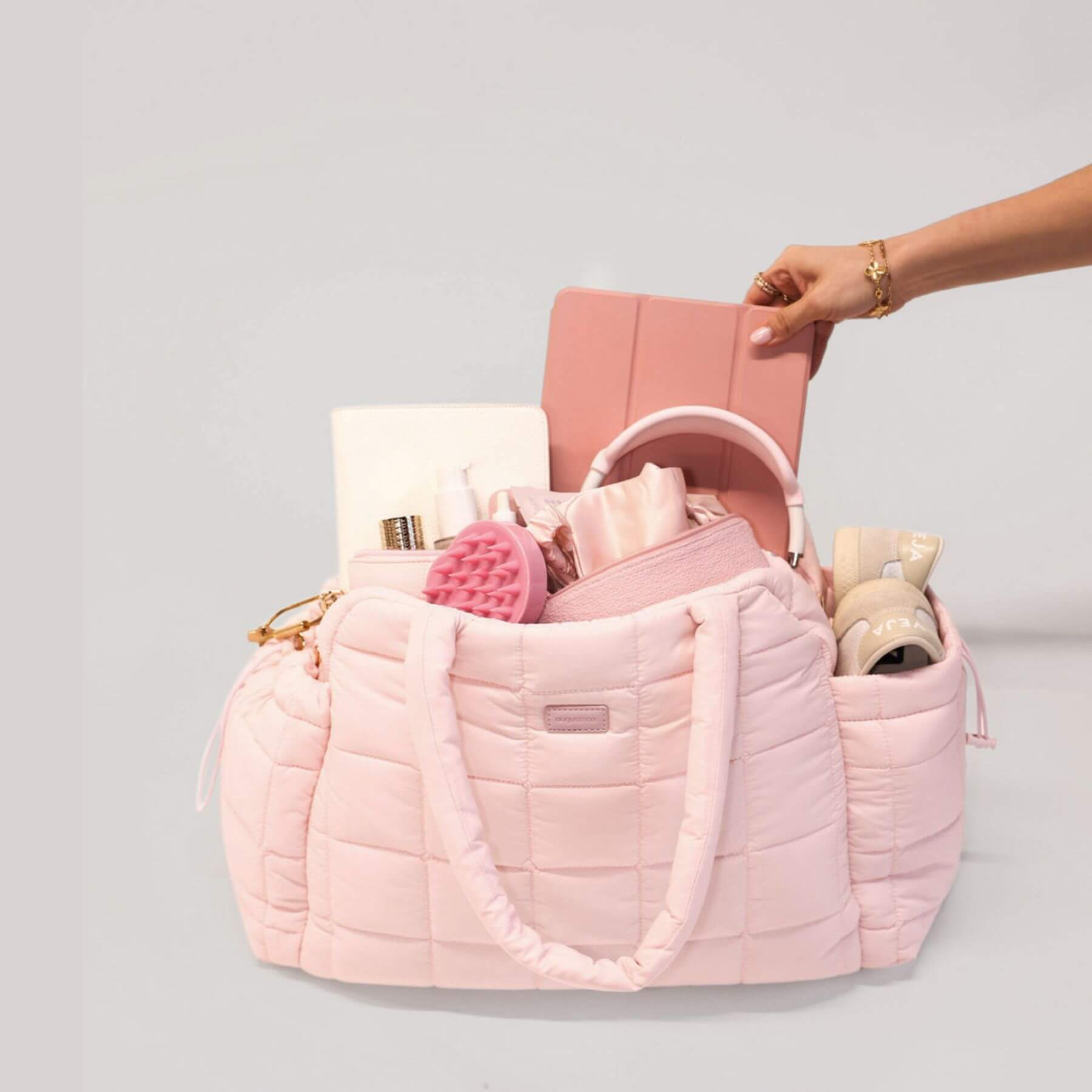 augustnoa the weekender duffle bag pink with baby items
