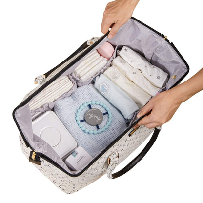 Open Sunveno Weekender Mommy Bag Travel Duffle - White Classic with baby items including diapers, wipes, and a toy