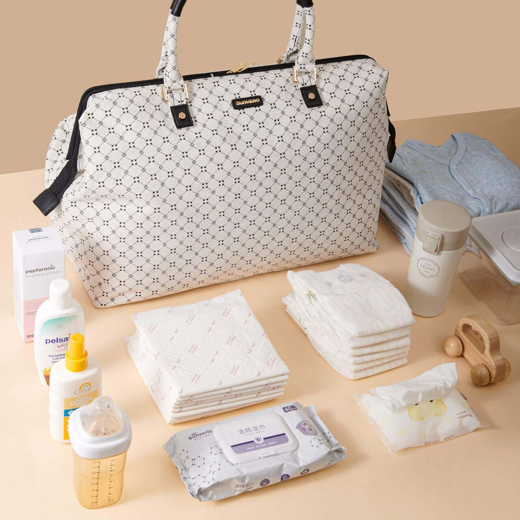 Sunveno Weekender Mommy Bag Travel Duffle - White Classic with baby care items on a beige background