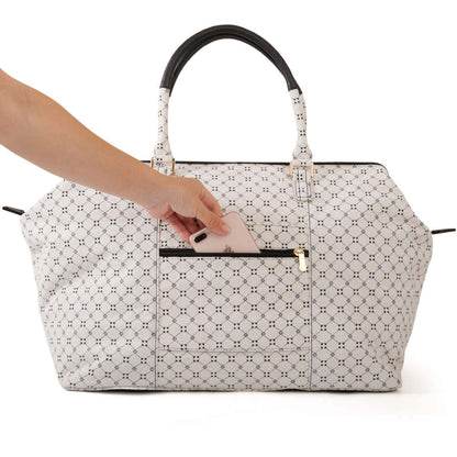 Sunveno Weekender Mommy Bag Travel Duffle - White Classic with a hand reaching in to open a zipper pocket