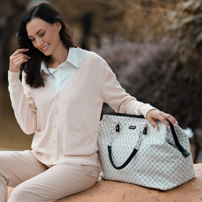 Woman sitting outdoors with Sunveno Weekender Mommy Bag Travel Duffle - White Classic