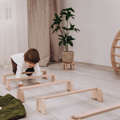Boy Playing Wood and Hearts Balance Beam Set