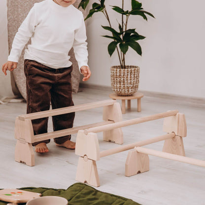 Boy Playing Wood and Hearts Balance Beam Set