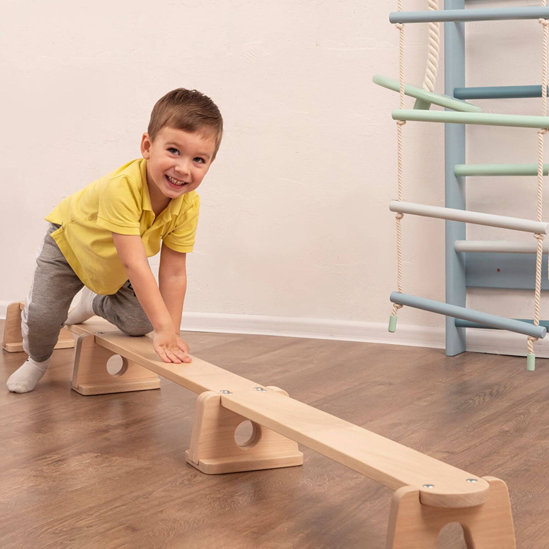 Boy Crawling on Wood and Hearts Balance Beam Straight