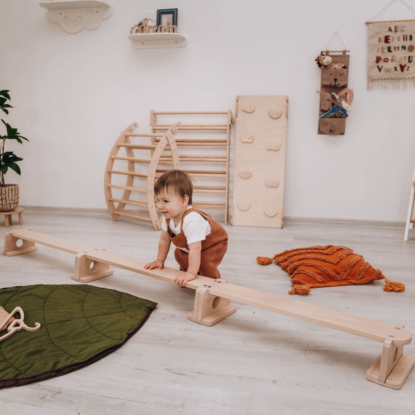 Boy Playing near Wood and Hearts Balance Beam Straight