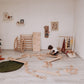Kid Setting up Wood and Hearts Balance Beam Zigzag