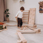 Kid Setting up Wood and Hearts Balance Beam Zigzag