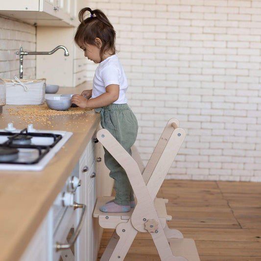Girl Standing on Wood and Hearts Foldable Kitchen Tower in Natural Wood
