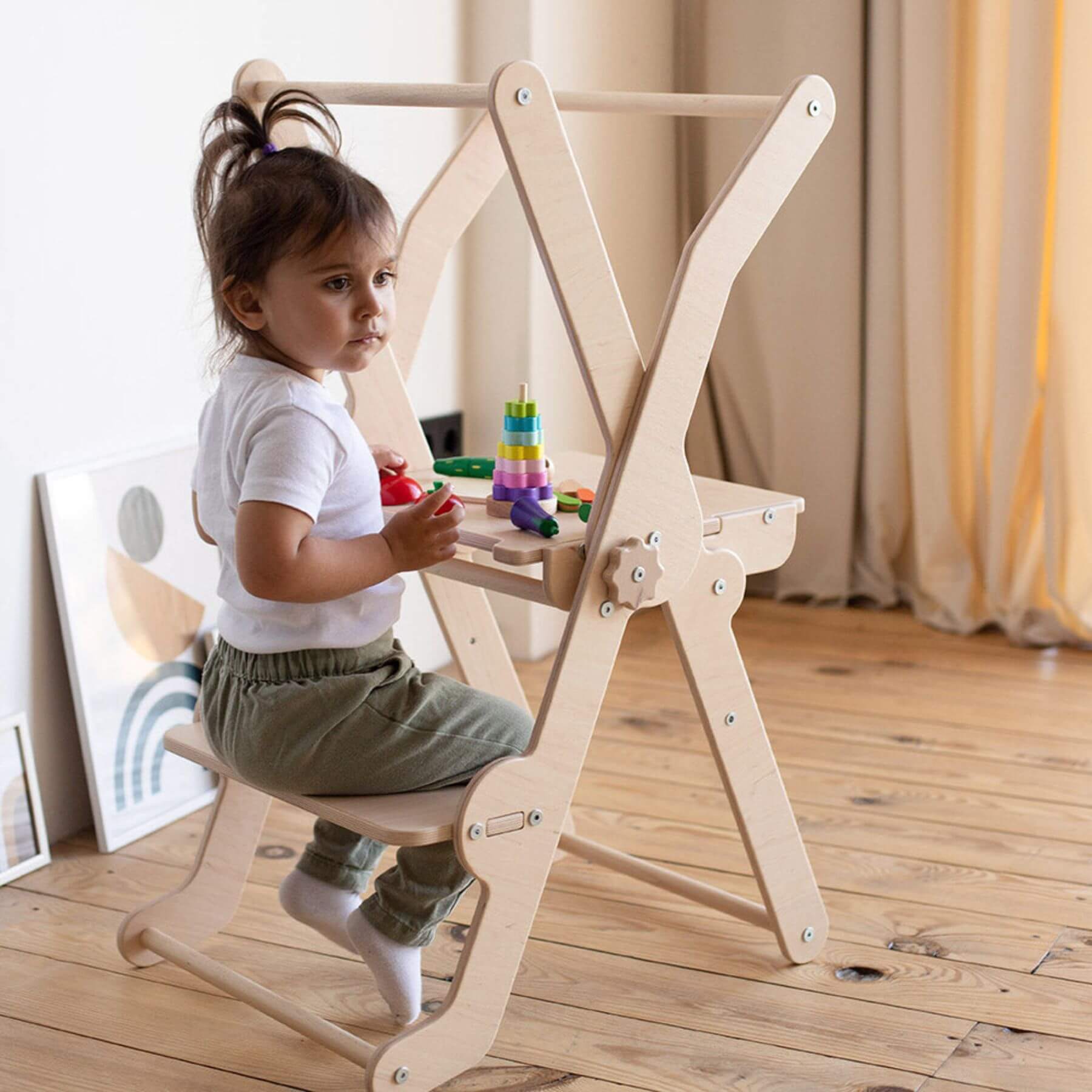 Girl Sitting on Wood and Hearts Foldable Kitchen Tower in Natural Wood