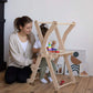 Mom & Kid Playing Toys at Wood and Hearts Foldable Kitchen Tower in Natural Wood