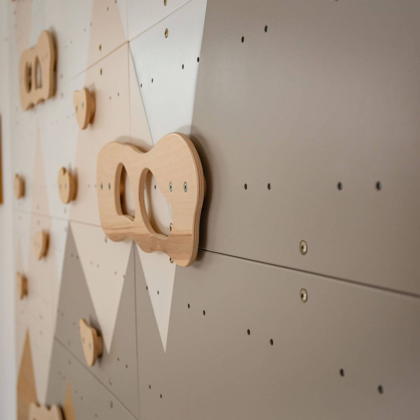 Wood and Hearts Indoor Climbing Wall on a wall with geometric shapes