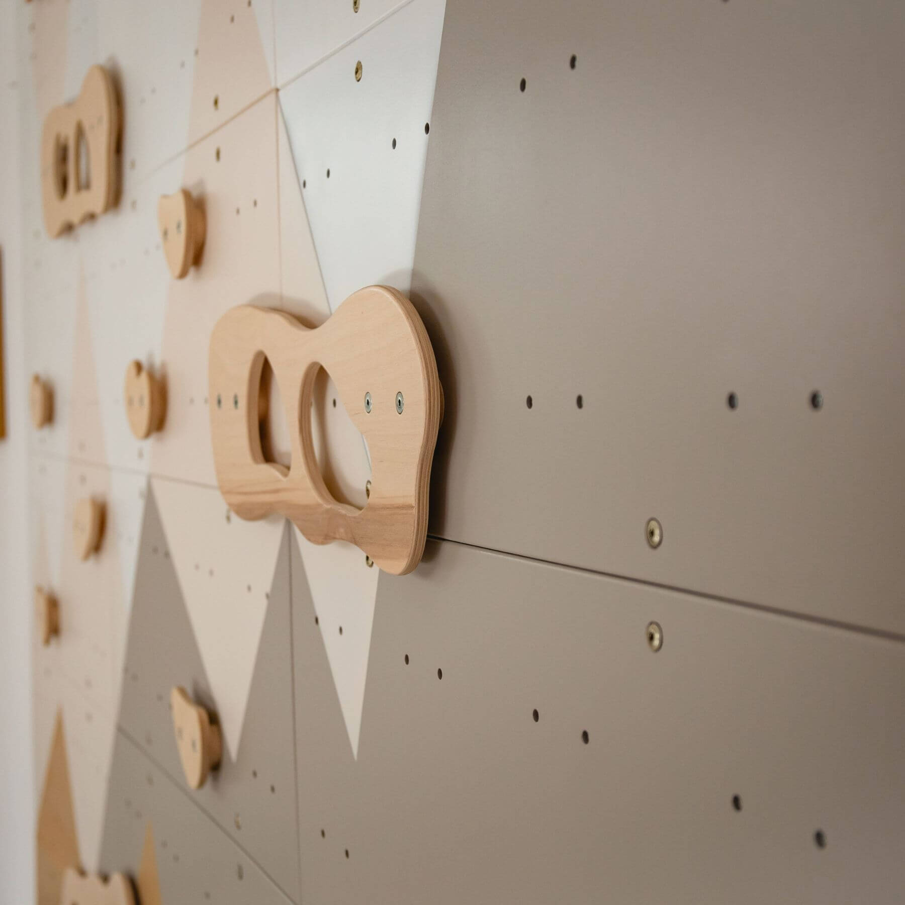 Wood and Hearts Indoor Climbing Wall on a wall with geometric shapes