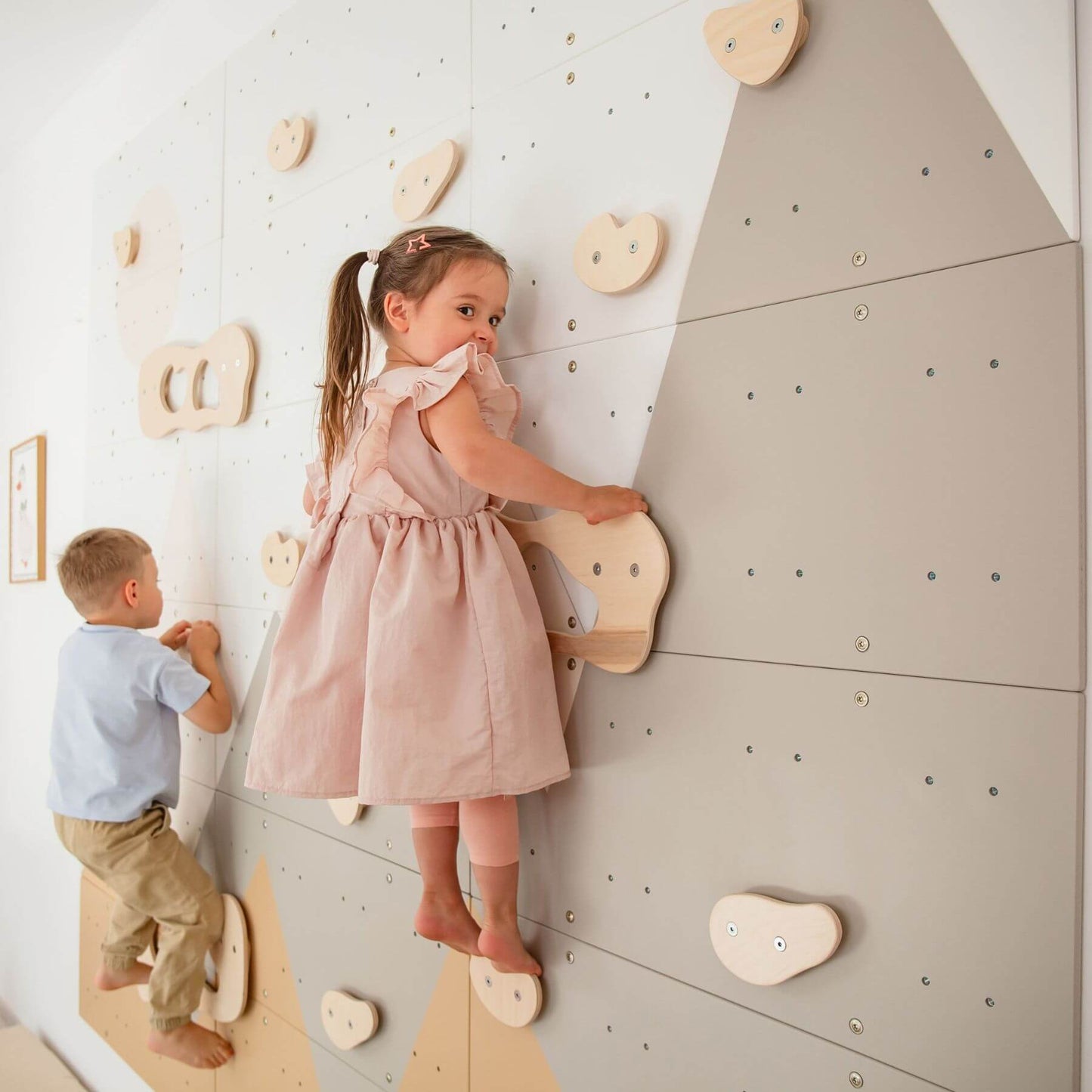 Two children on Wood and Hearts Indoor Climbing Wall