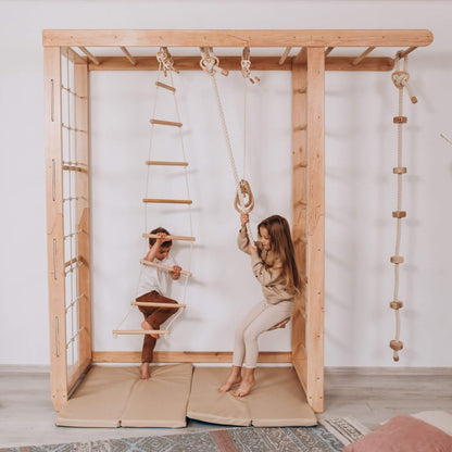 Two children playing on Wood and Hearts Indoor Monkey Bars - Natural