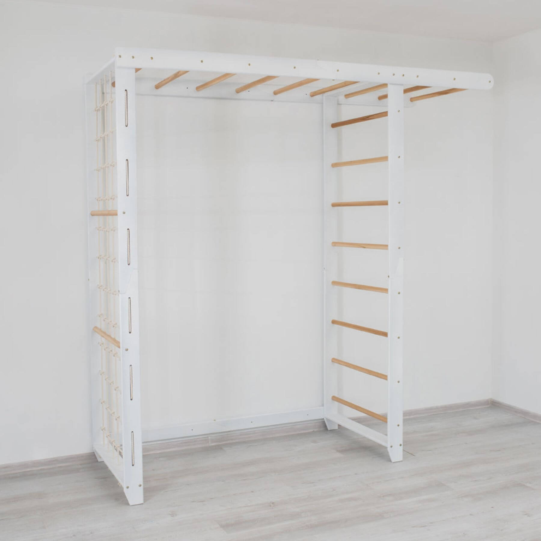Wood and Hearts Indoor Monkey Bars - White against a plain white wall.