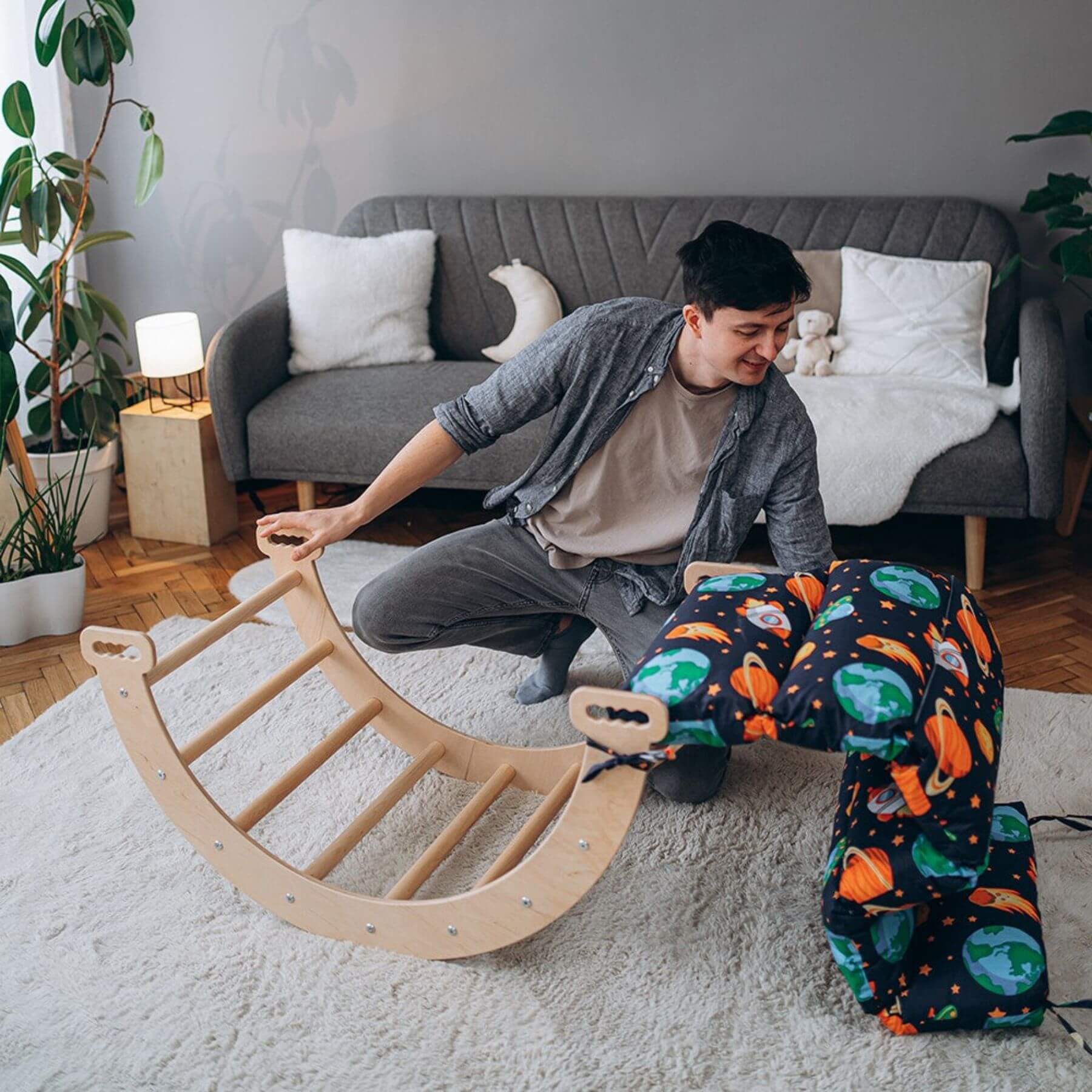 Man Setting up Wood and Hearts Large Climbing Arch + Pillow Open Space