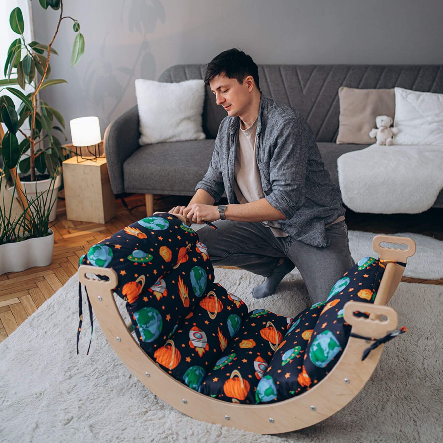 Man Setting up Wood and Hearts Large Climbing Arch + Pillow Open Space