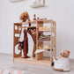 Boy Standing Behind Wood and Hearts Montessori Closet