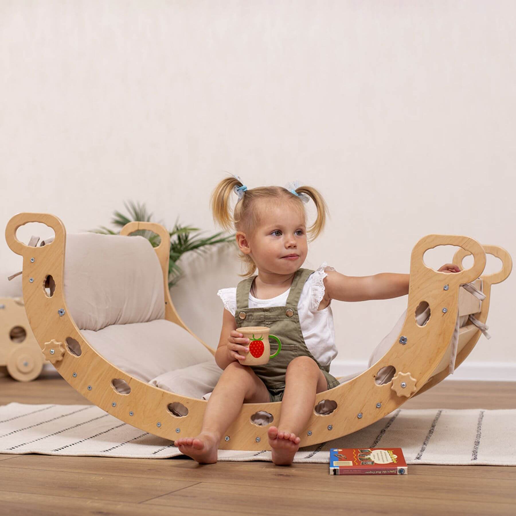 Girl Sitting on Wood and Hearts Montessori Rocker & Pillow Sandy Bay