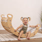 Girl Sitting on Wood and Hearts Montessori Rocker & Pillow Spring Hiking