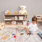 Boy Playing next to Wood and Hearts Montessori Shelf