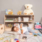 Boy Lying next to Wood and Hearts Montessori Shelf