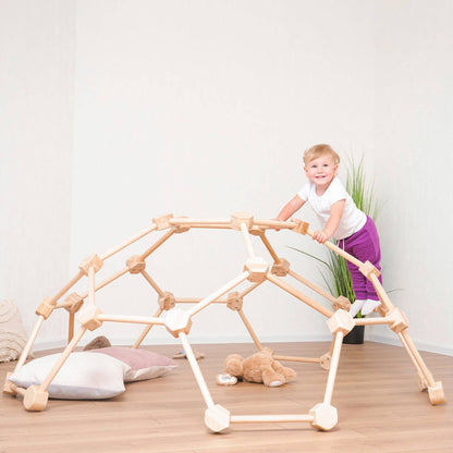 Girl Playing Wood and Hearts Wooden Climbing Dome