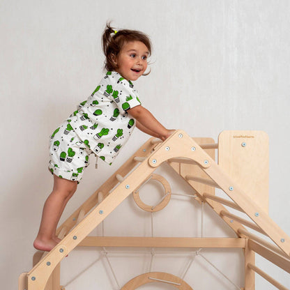 Girl Climbing on Top of Wood and Hearts Wooden Climbing Playhouse Natural