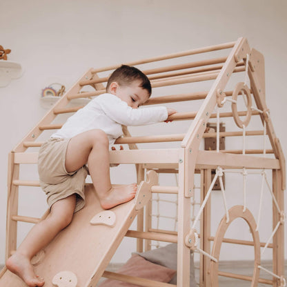 Boy Climbing on Wood and Hearts Wooden Climbing Playhouse w/ Ramp Natural