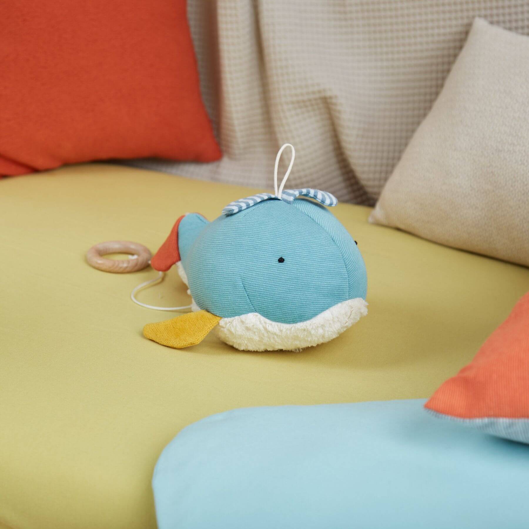 sigikid Organic Whale Musical Toy on couch