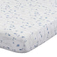 Quilted baby blanket with blue fish pattern on a white background