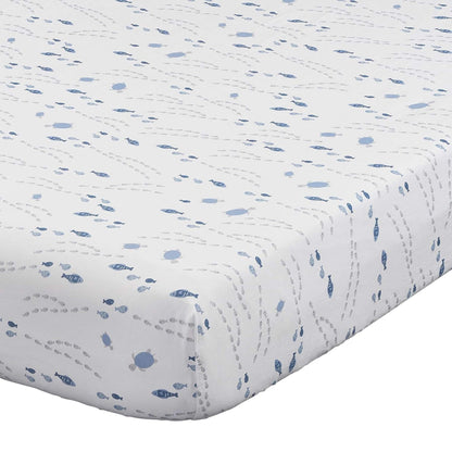 Quilted baby blanket with blue fish pattern on a white background