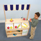 Boy Playing at Whitney Brothers Preschool Market Stand