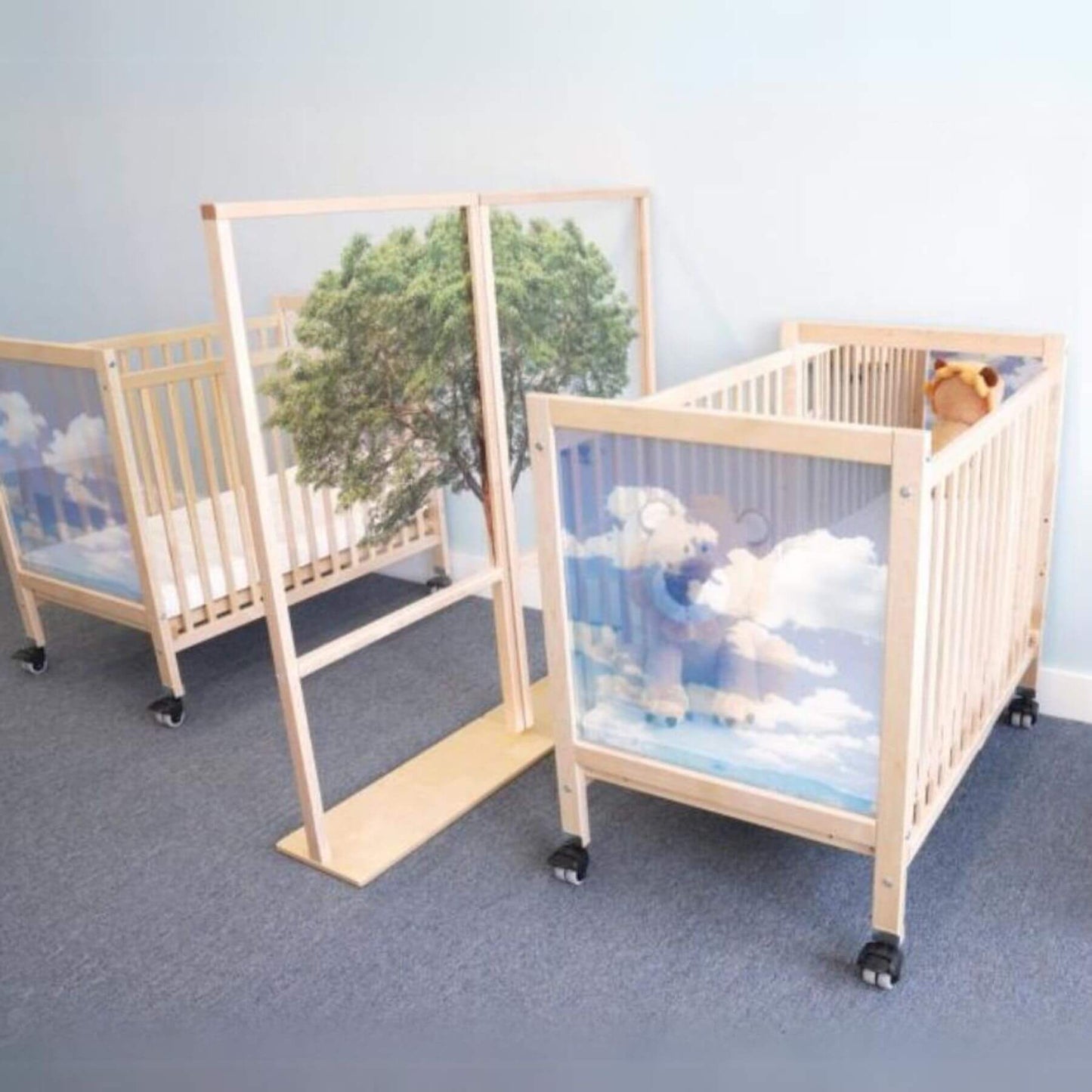 Two Whitney Brothers Tranquility Infant Cribs Divided by Room Divider