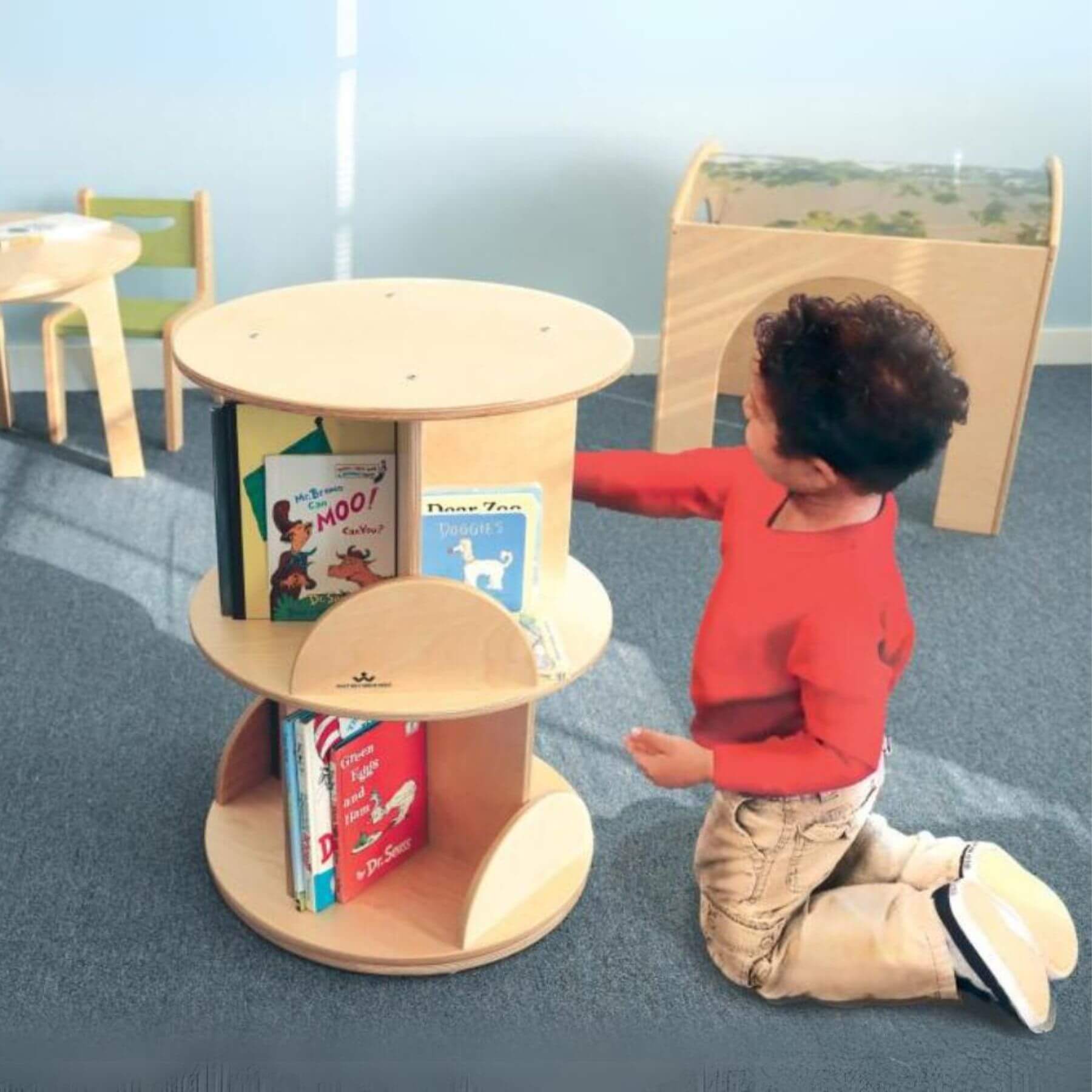 Boy Getting Books from Whitney Brothers Two Level Book Carousel