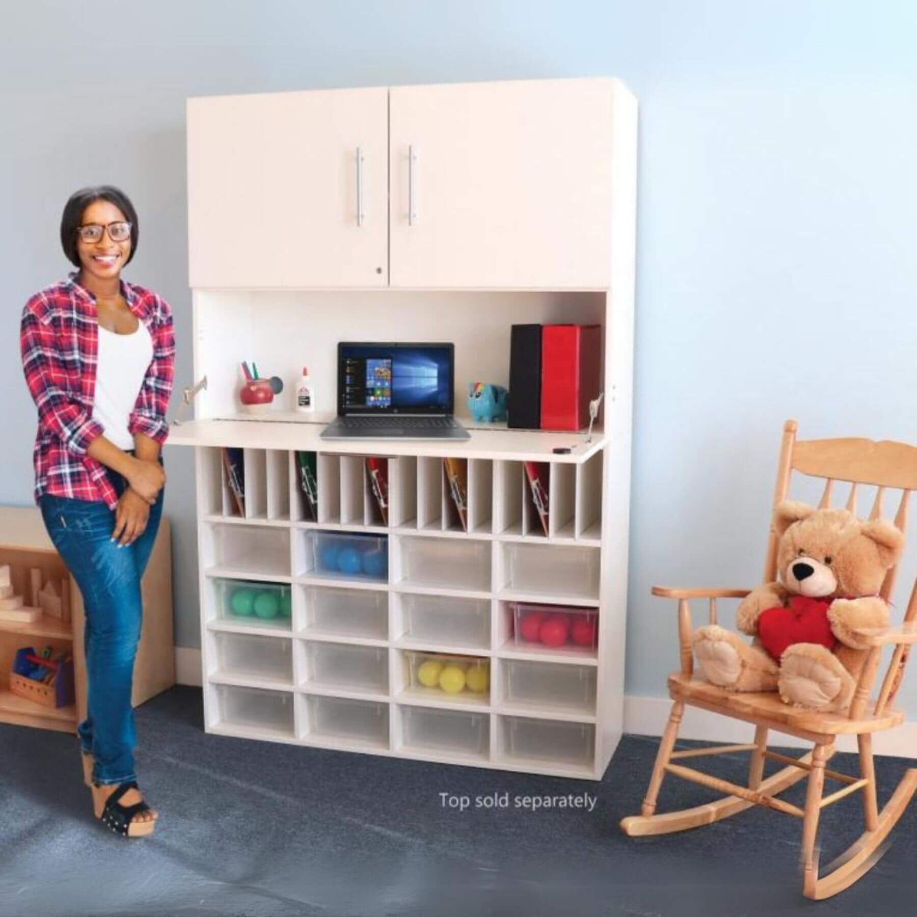 Woman Standing in front of Whitney Brothers Whitney White Cubby Organizer Cabinet