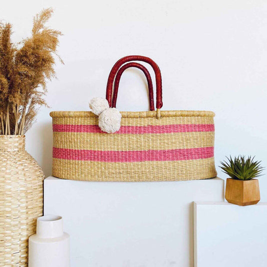 Wildflower No Hood African Moses Basket on a white surface with decorative elements.