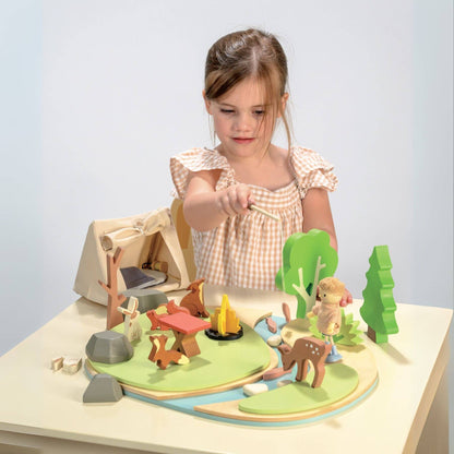 Child playing with Tender Leaf Wildlife Camping Playset on a table