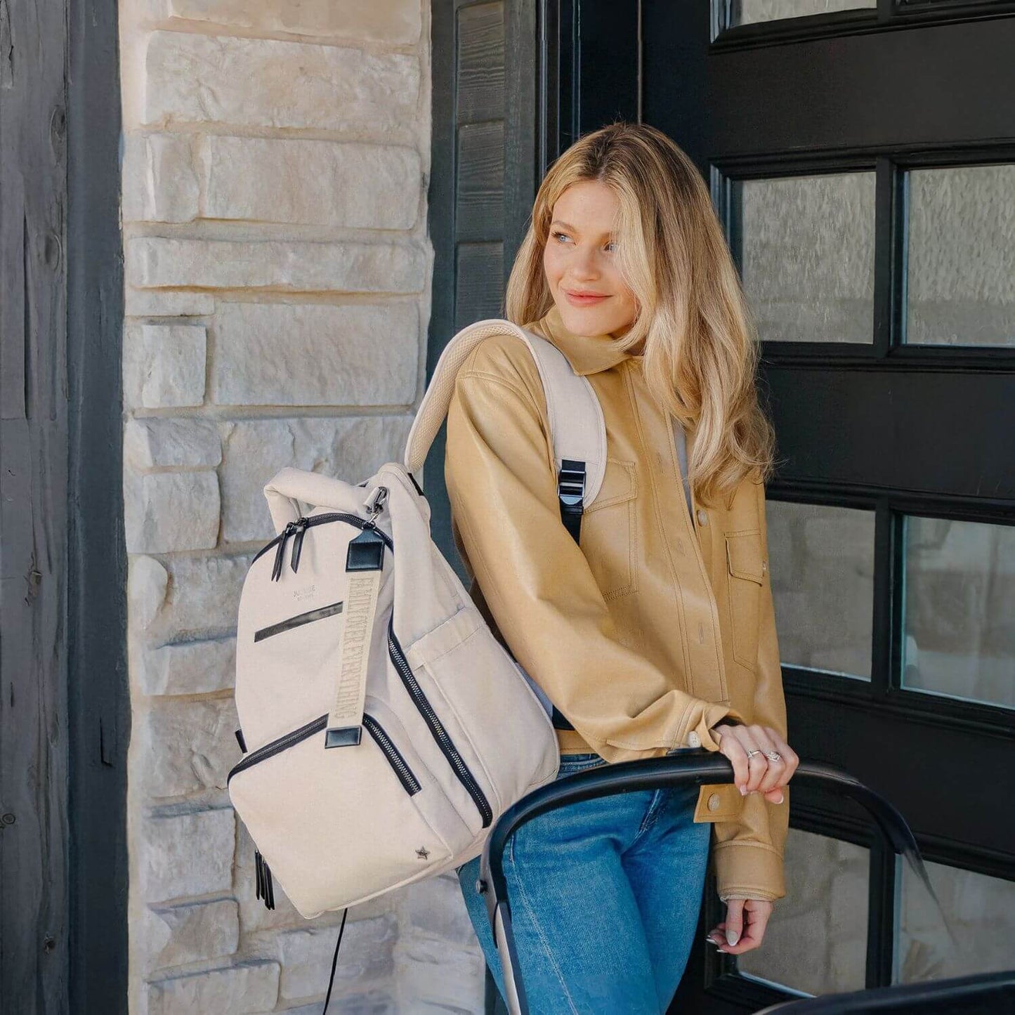 Woman Carrying Witney Carson Classic Diaper Backpack - Cloud