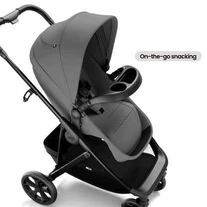 A stroller in dark gray and black with an integrated seat, canopy, and cup holder, shown on a clean white background with a text label that reads 'On-the-go snacking'.