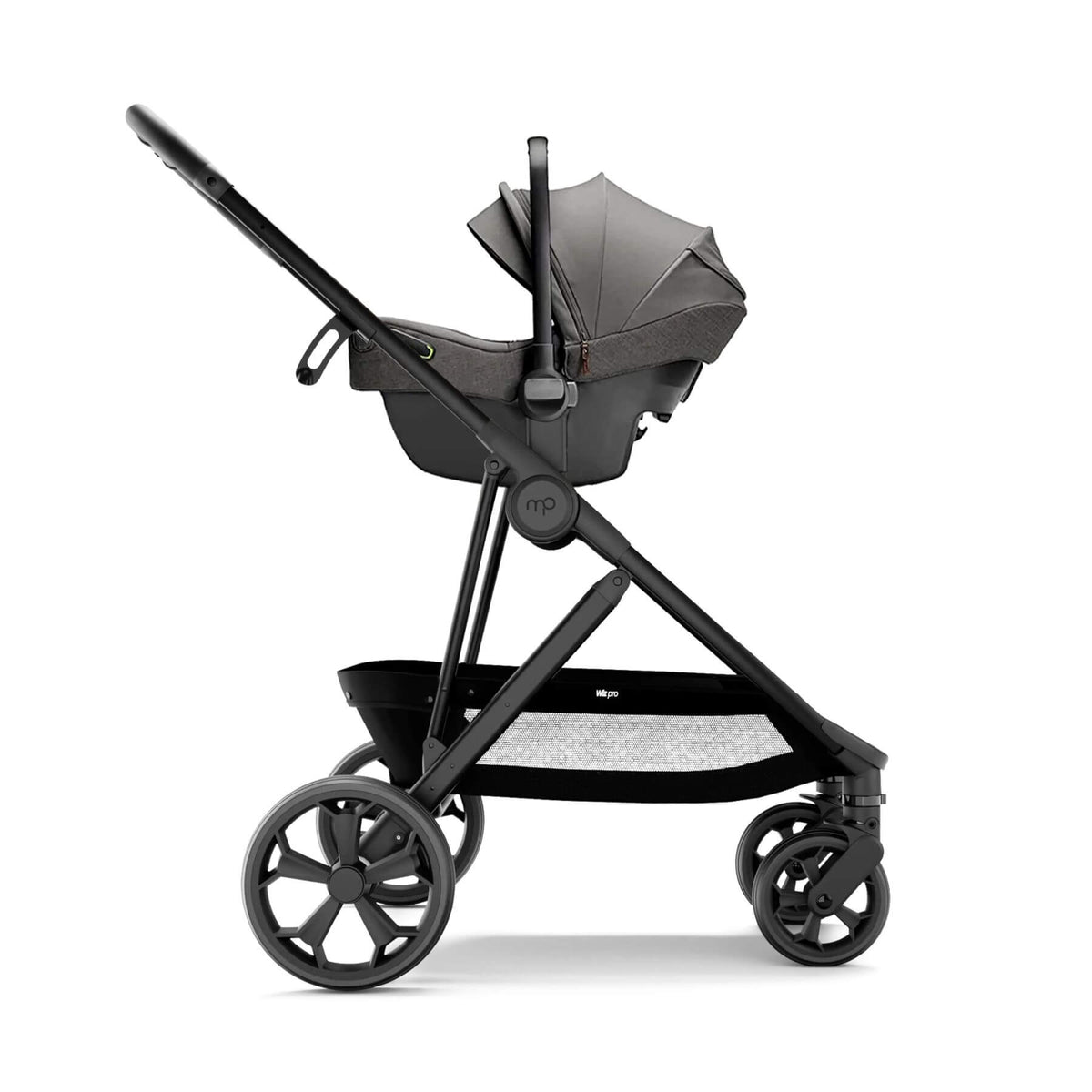 A premium stroller and bassinet travel system in a monochrome dark gray and black colorway, shown from a side profile against a clean white background.
