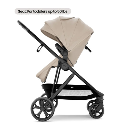 Mompush Wiz Pro - Khaki, with a text label at the top reading 'Seat: For toddlers up to 50 lbs'. The seat fabric is a warm light beige/tan, while the frame and wheels are black.